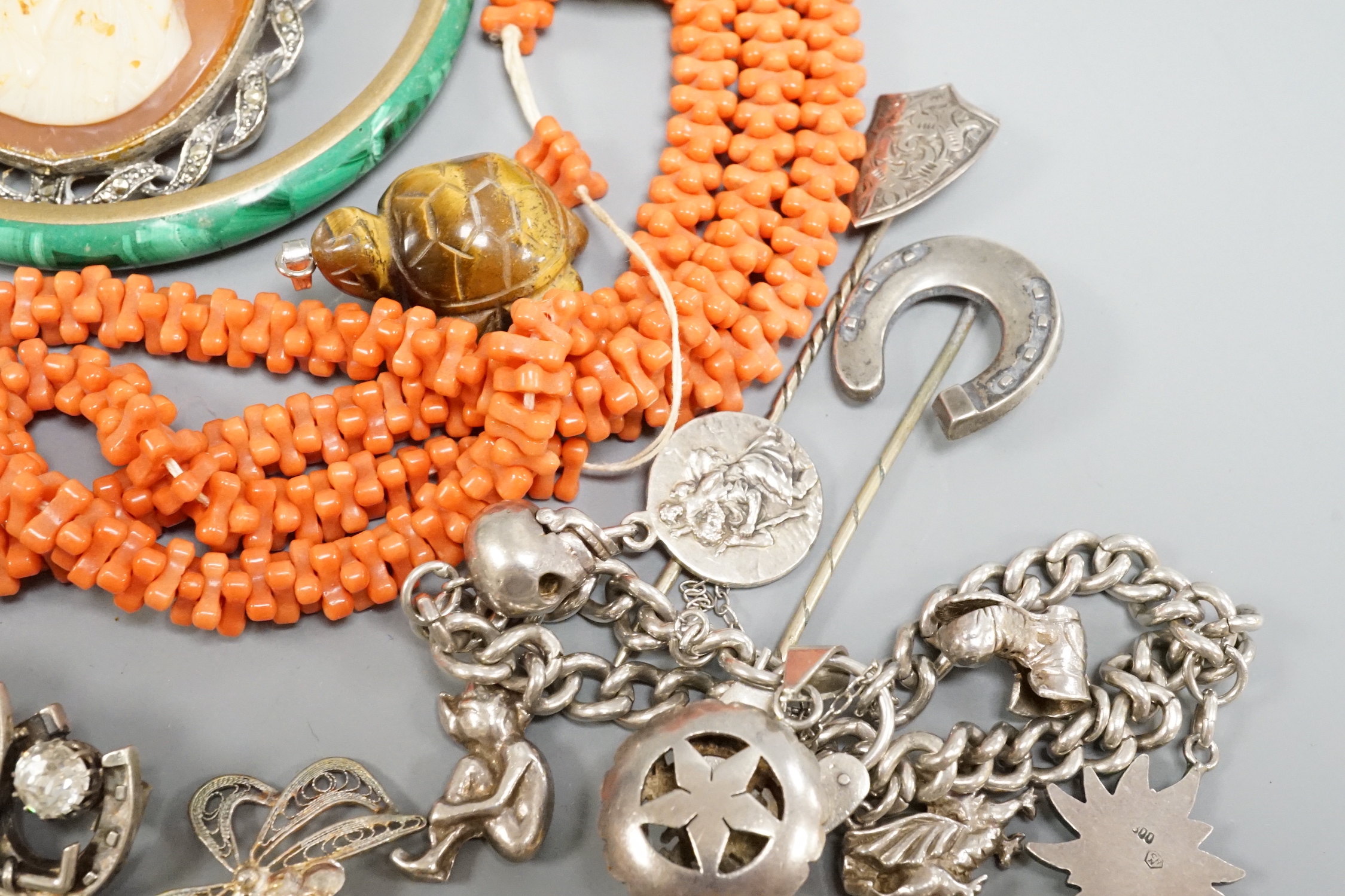 A Victorian silver oval locket and other jewellery including and coral necklace and white metal charm bracelet stamped 'silver, etc.